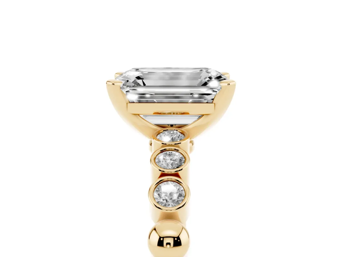 Emerald Cut Solitaire Bezel Accent Diamond Engagement Ring with Beaded Band and Four-Prong Setting Yellow gold