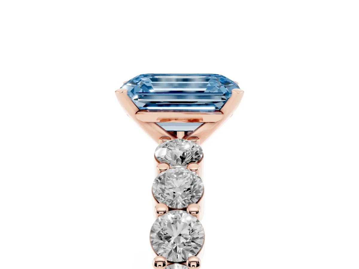 Fancy Blue Emerald Cut Diamond Solitaire Ring with Shared Prong Round Side Stones Rose gold