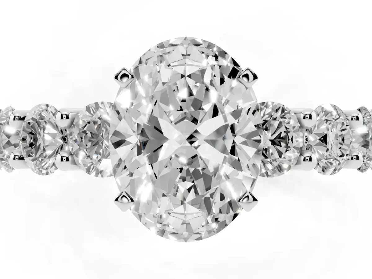 Oval Cut Diamond Prong Setting with Side Stones on a Pave Band Silver