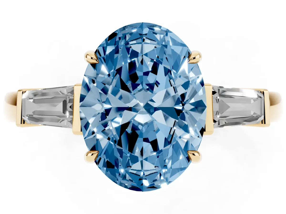 Fancy Blue Oval Cut Diamond Three-Stone Ring with Tapered Baguette Side Stones and Prong Setting Yellow gold
