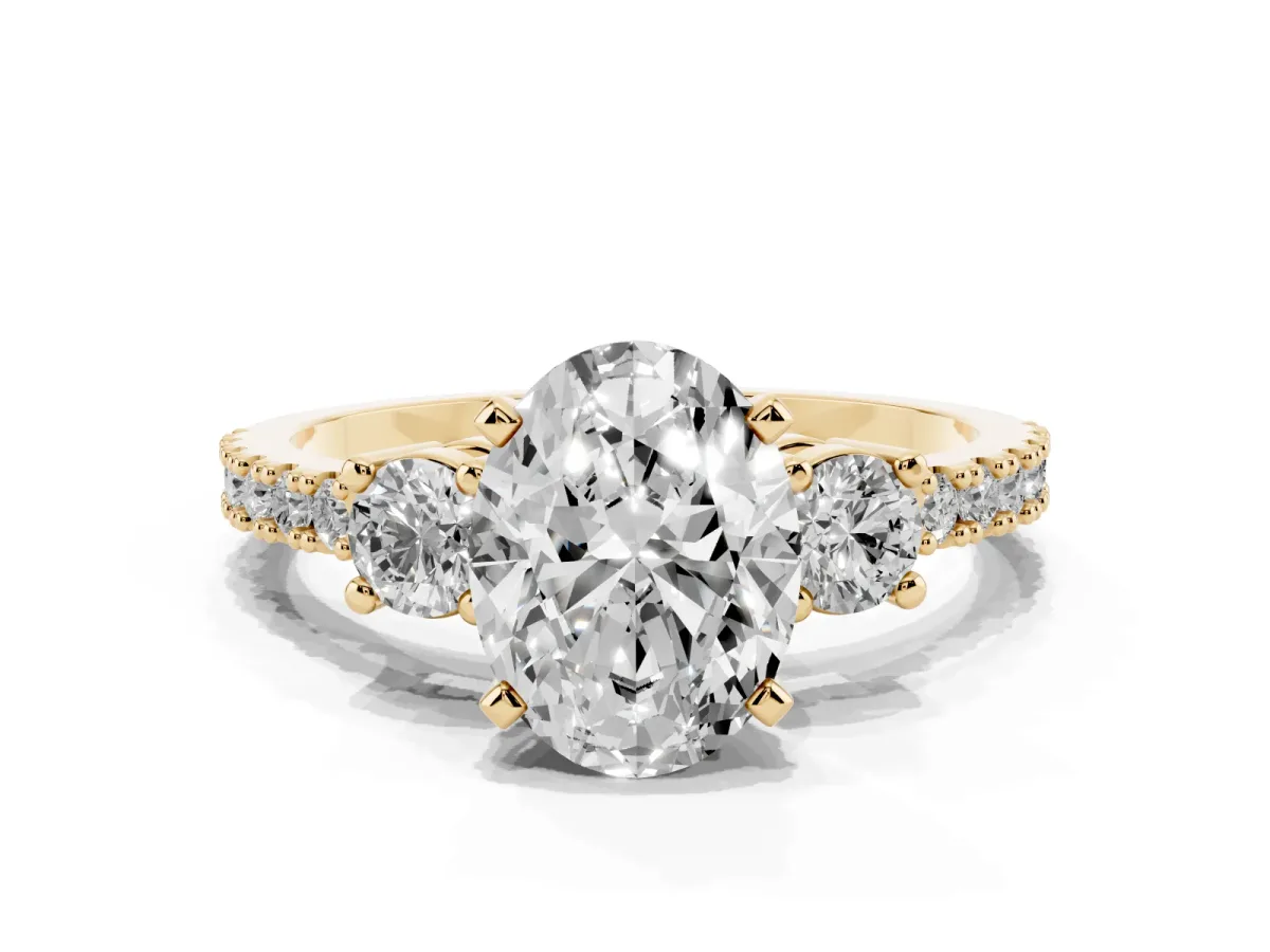 Oval Cut Three-Stone Diamond Pavé Band with Prong Setting Yellow gold