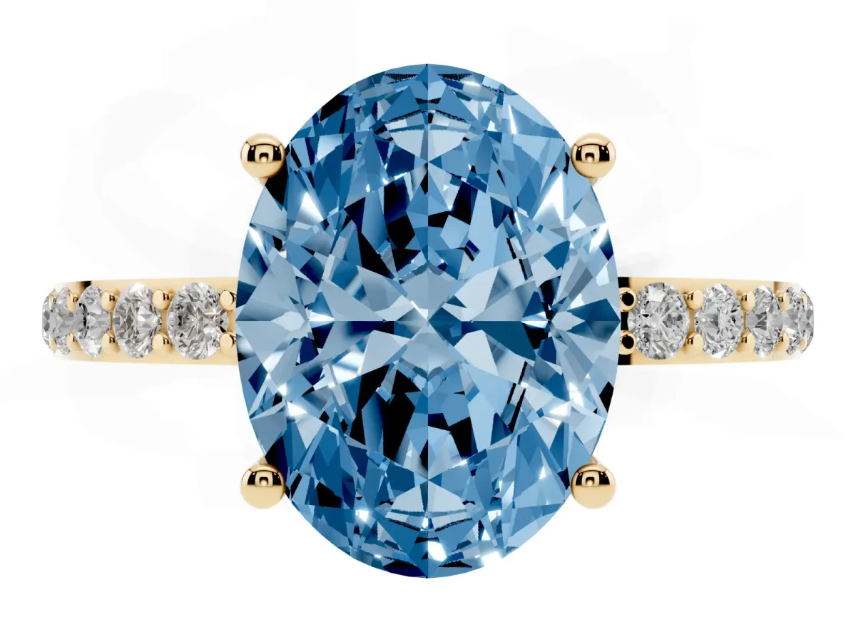Fancy Blue Oval Cut Diamond Solitaire Ring with Round Pavé Shoulders and Prong Setting Yellow gold
