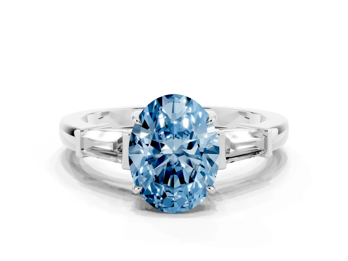 Fancy Blue Oval Cut Diamond Three-Stone Ring with Tapered Baguette Side Stones and Prong Setting Silver