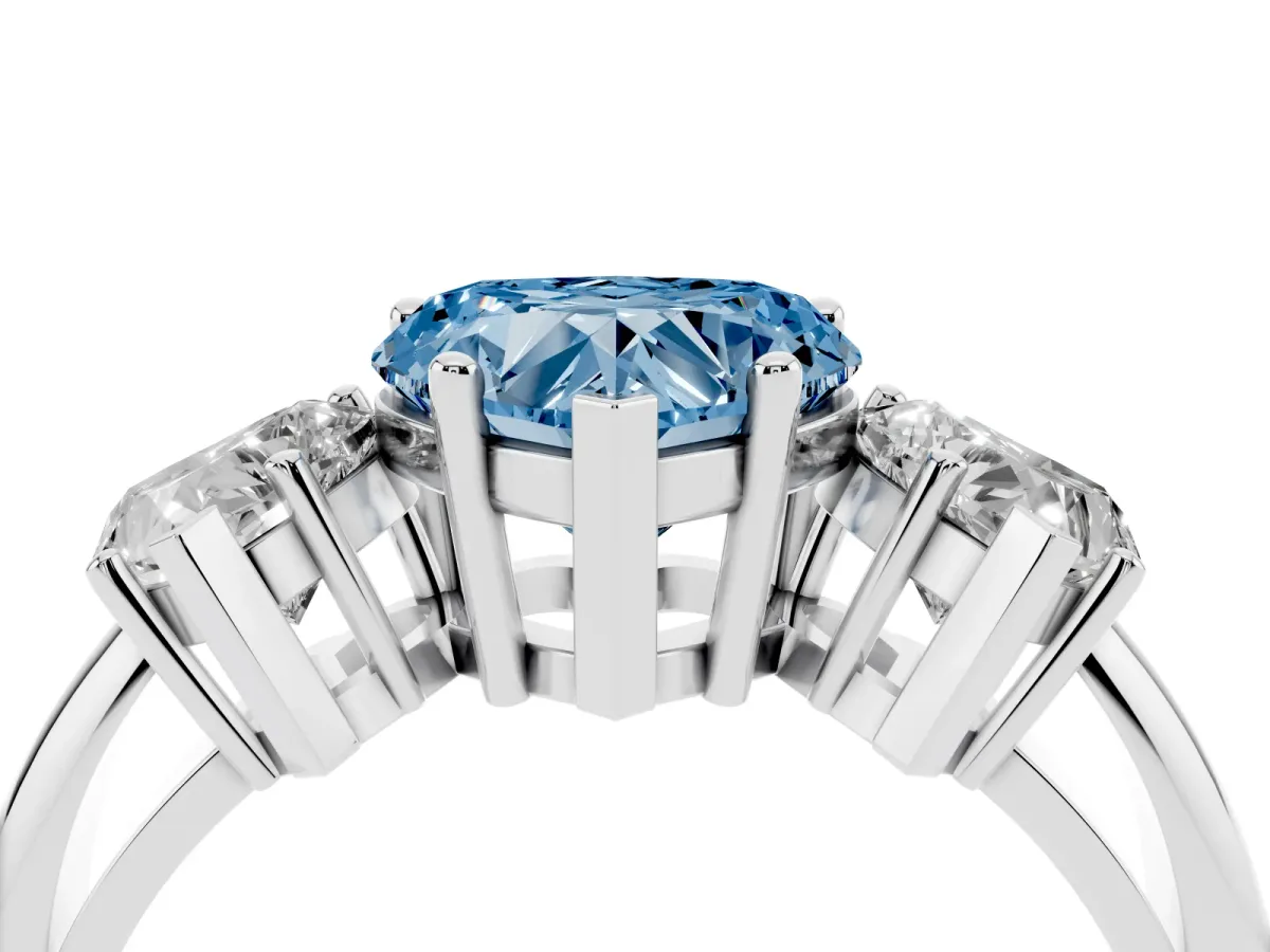 Fancy Blue Three-Stone Heart Cut Cut Diamond Engagement Ring with Prong Setting on a White Gold Band Platinum