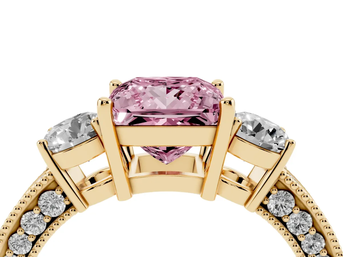 Fancy Pink Princess Cut Three-Stone Diamond Ring with Pavé Band and Four-Prong Setting Yellow gold