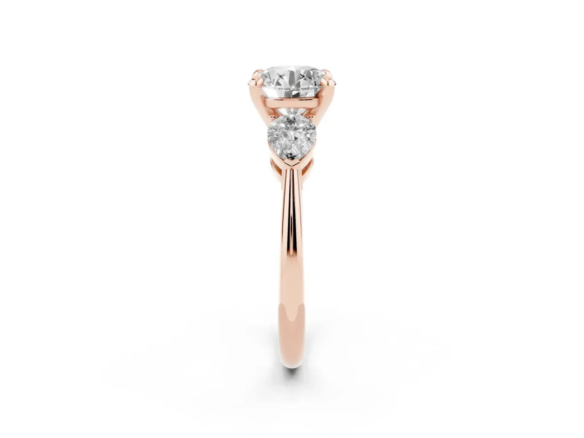 Three-Stone Round Cut Diamond Ring with Pear Side Stones and Four-Prong Setting Rose gold