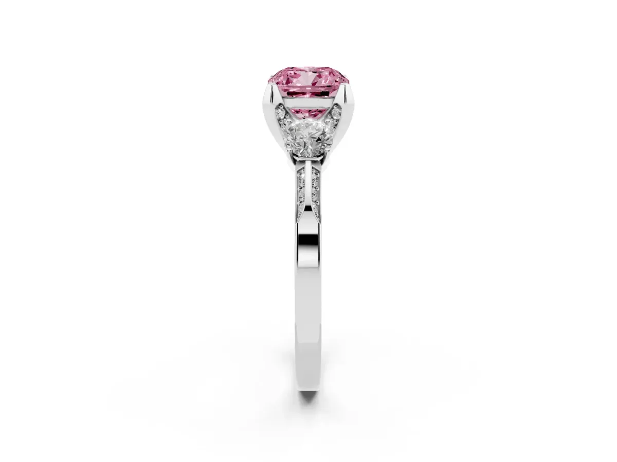 Fancy Pink Cushion Cut Brilliant Three-Stone Diamond Ring with Pavé Band and Four-Prong Setting Platinum