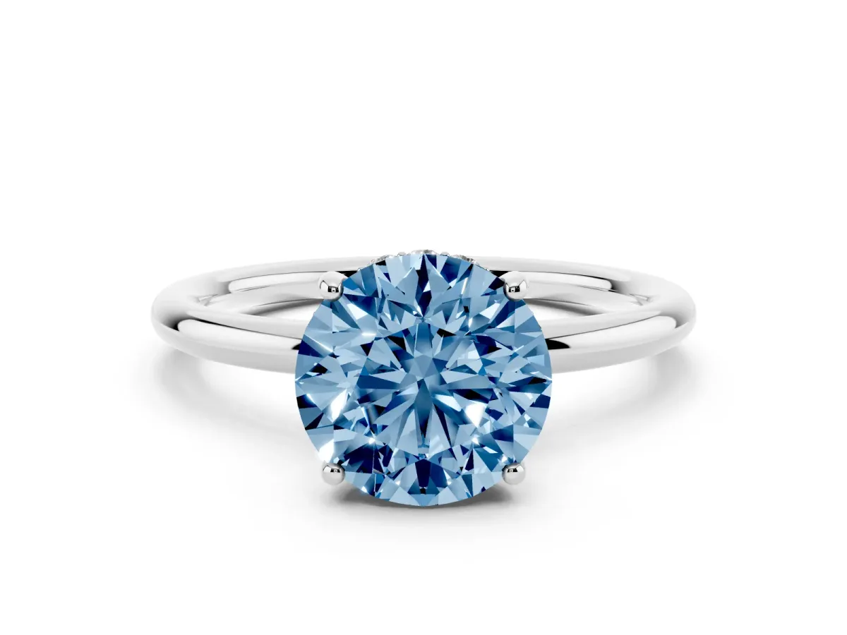 Fancy Blue Round Cut Solitaire Diamond Ring with a Classic Band and Four-Prong Setting Silver