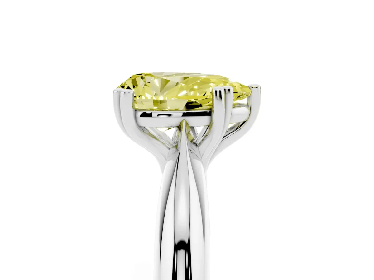 Fancy Yellow Pear Cut Cut Solitaire Engagement Ring with Tapered Band and Four-Prong Setting Silver