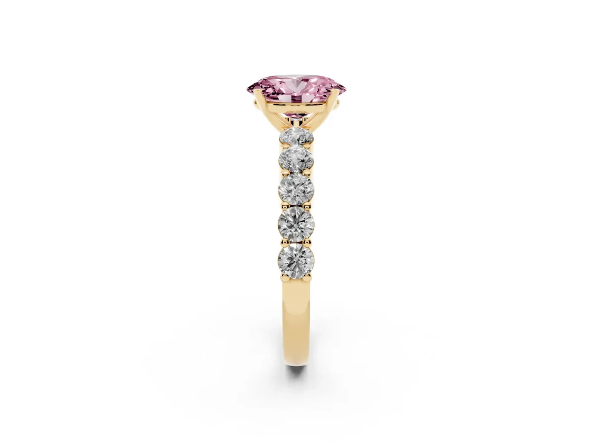 Fancy Pink Oval Cut Diamond Solitaire Ring with Shared Prong Round Side Stones Yellow gold
