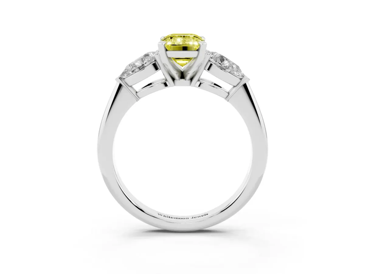 Fancy Yellow Three-Stone Emerald Cut Diamond Ring with Pear Side Stones and Four-Prong Setting Silver