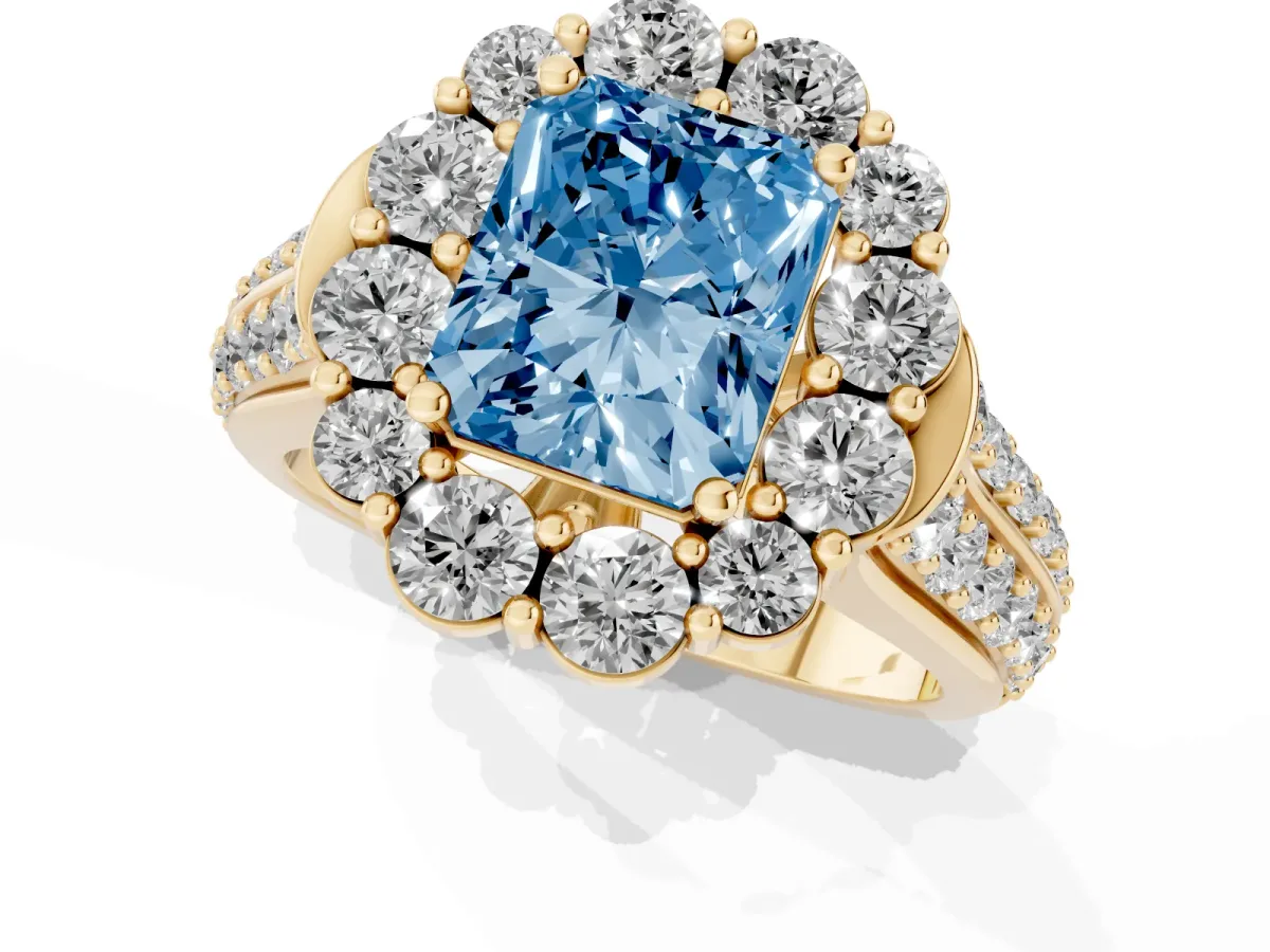 Fancy Blue Radiant Cut Halo Diamond Engagement Ring with Split Shank and Prong Setting Yellow gold