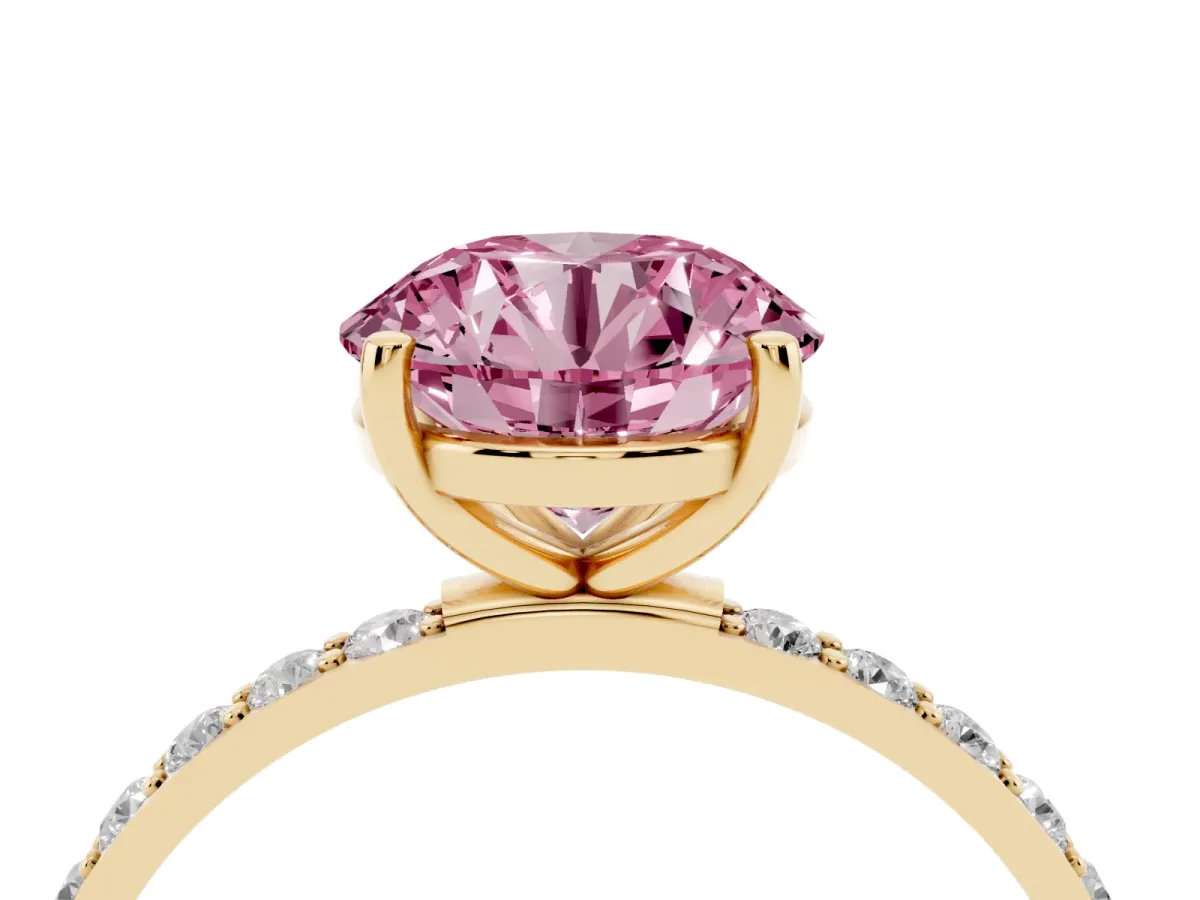 Fancy Pink Round Cut Diamond Solitaire Ring with Round Pavé Shoulders and Prong Setting Yellow gold