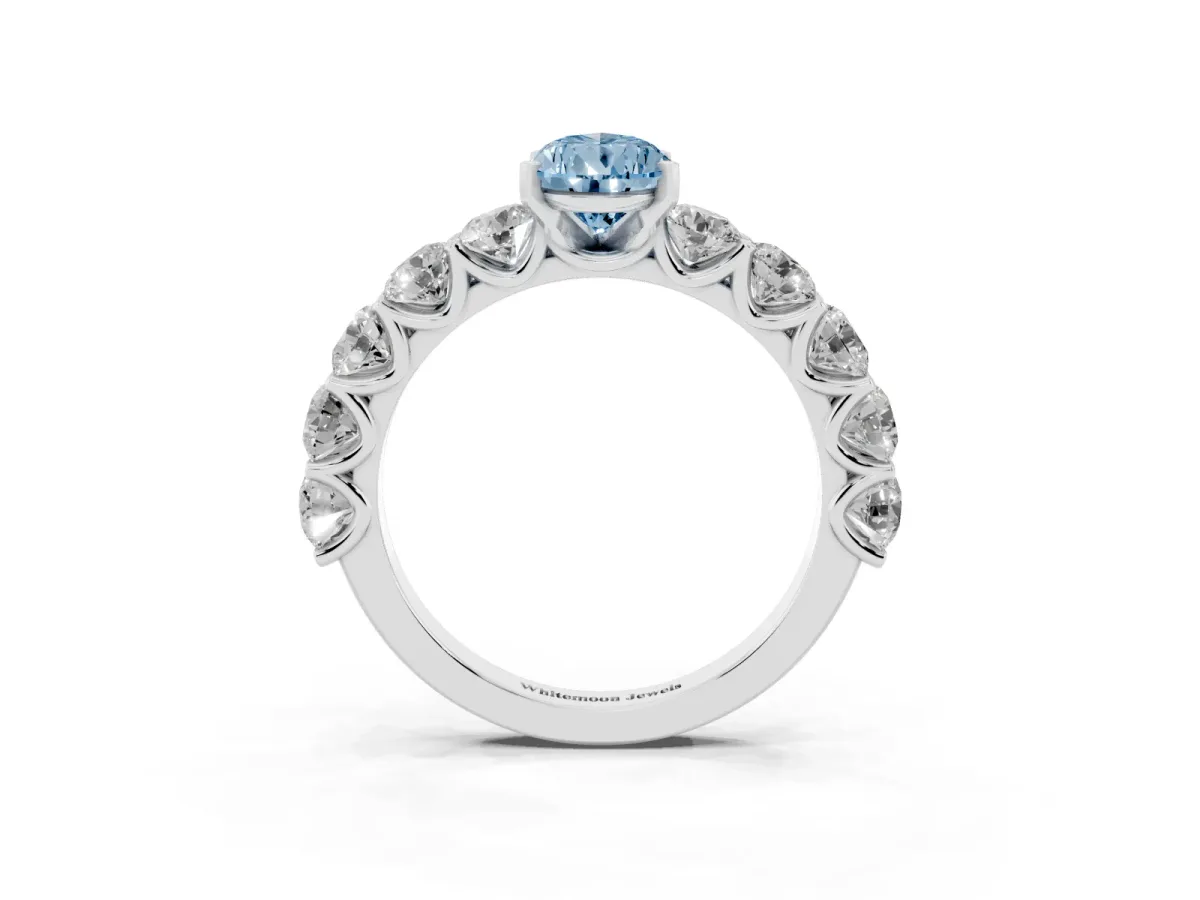Fancy Blue Pear Cut Diamond Prong Setting with Side Stones on a Pave Band Platinum
