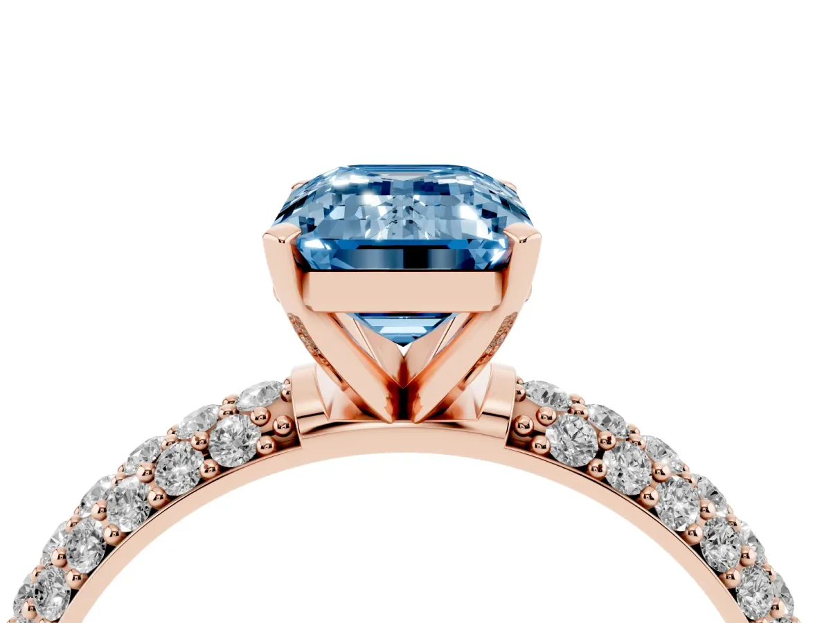 Fancy Blue Emerald Cut Diamond Solitaire Ring with Prong Setting and Pavé Band Rose gold