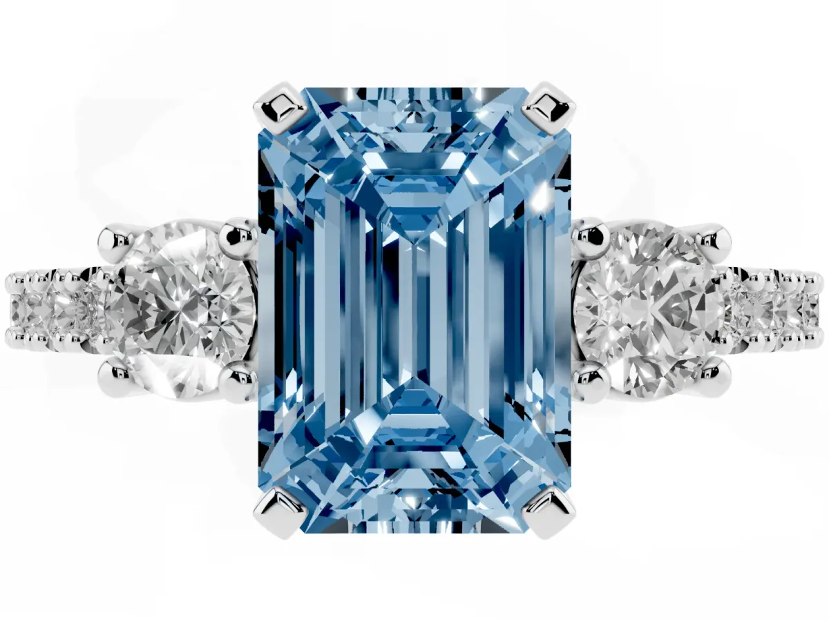 Fancy Blue Emerald Cut Three-Stone Diamond Pavé Band with Prong Setting Platinum