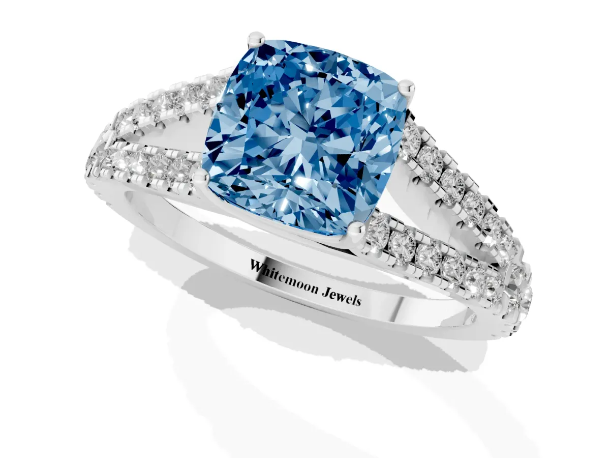 Fancy Blue Cushion Cut Diamond Split Shank Engagement Ring with Round Pavé and Prong Setting Platinum