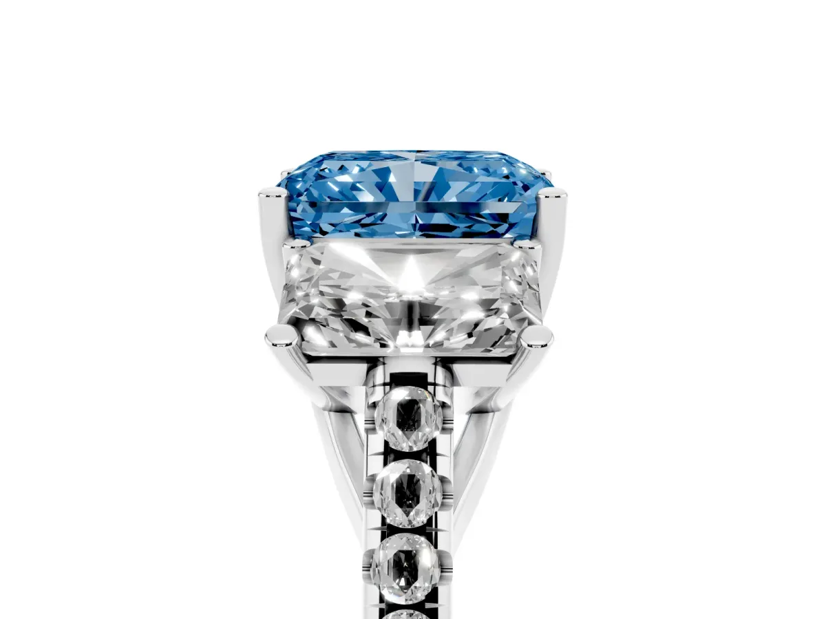 Fancy Blue Three-Stone Radiant Cut Diamond Ring with Round Pavé Band and Prong Setting Silver