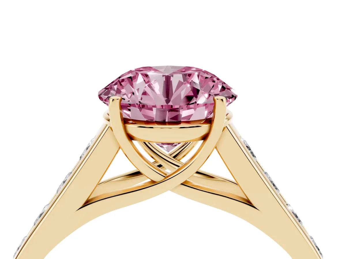 Fancy Pink Round Cut Solitaire Channel-Set Diamond Engagement Ring with Four-Prong Setting Yellow gold