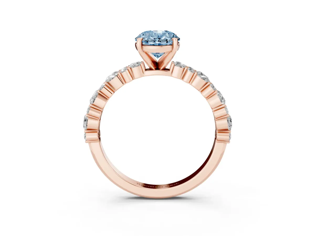 Fancy Blue Oval Cut Diamond Side Stone Solitaire Ring with Round and Four-Prong Setting Rose gold