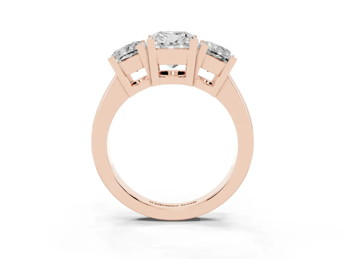 Three-Stone Cushion Cut Cut Diamond Ring with Channel Set Band and Four-Prong Setting Rose gold