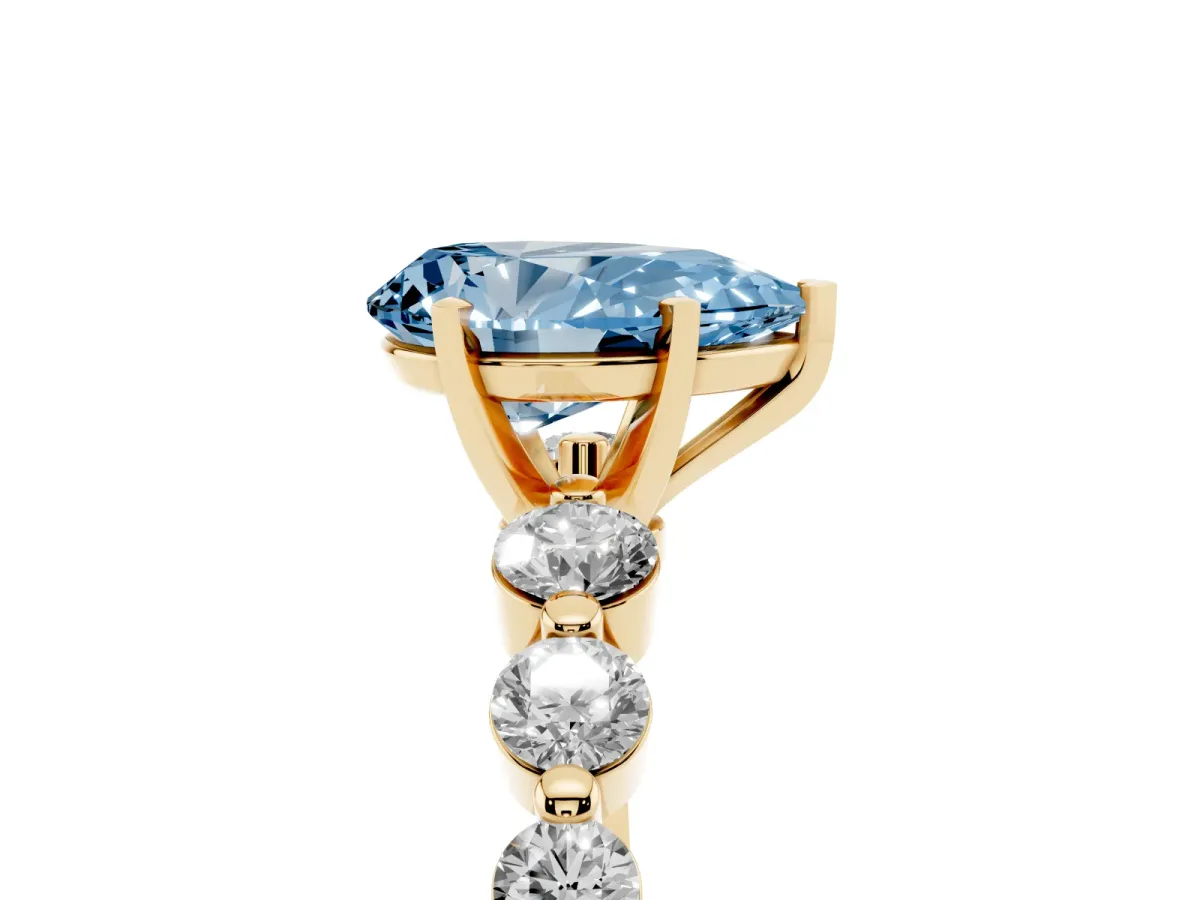Fancy Blue Pear Cut Solitaire Diamond Ring with Pave Band and Four-Prong Setting Yellow gold