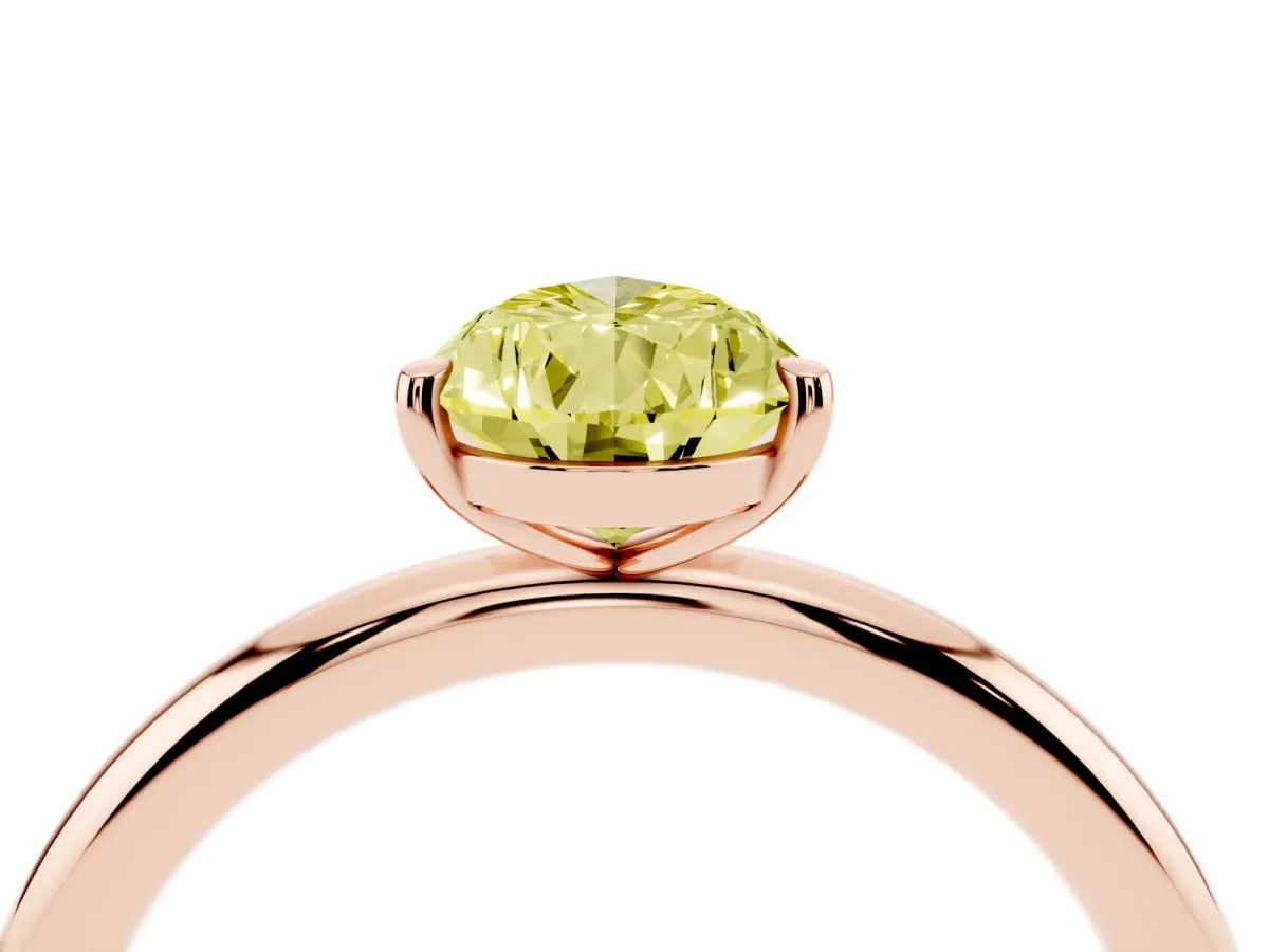 Fancy Yellow Pear Cut Solitaire Diamond Ring with Four-Prong Setting on a Plain Band Rose gold