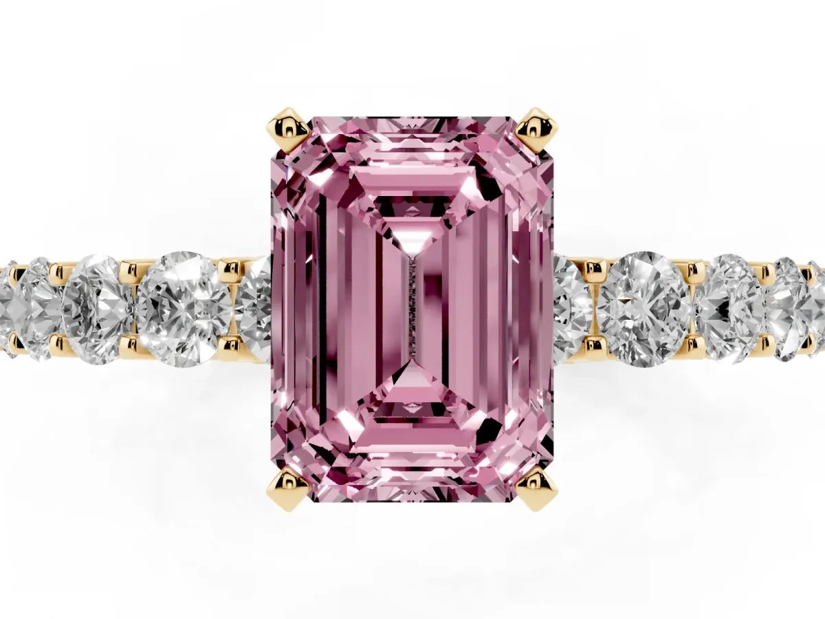 Fancy Pink Emerald Cut Diamond Solitaire Ring with Shared Prong Pavé Band and Four-Prong Setting Yellow gold
