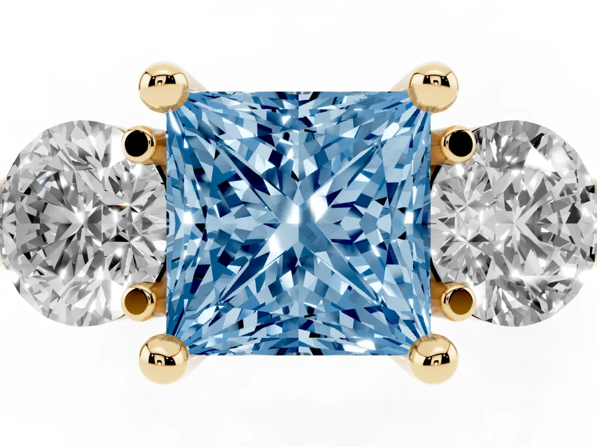 Fancy Blue Three-Stone Princess Cut Brilliant Cut Solitaire Ring with Prong Setting on a Classic Band Yellow gold