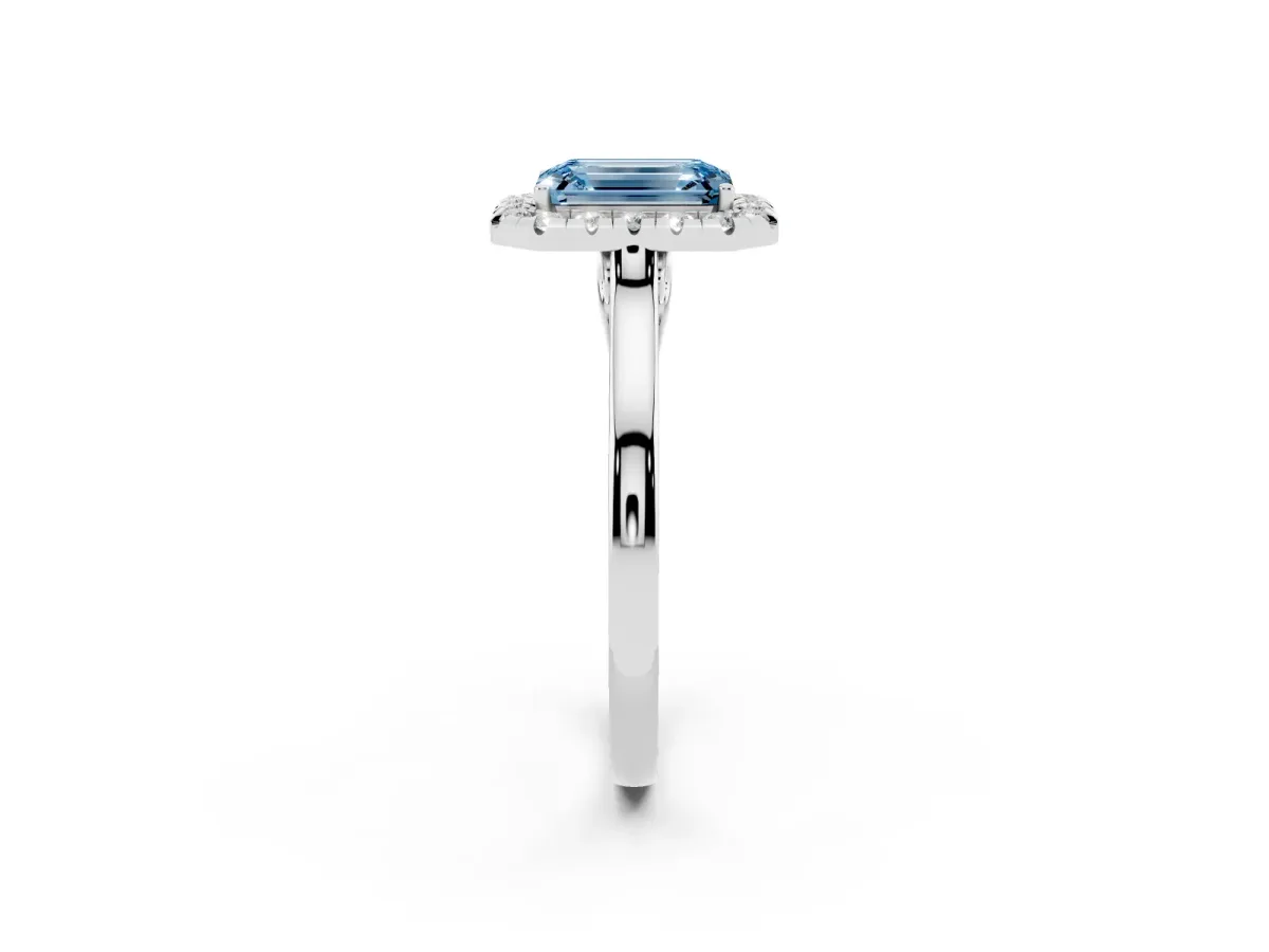 Fancy Blue Emerald Cut Halo Round Diamond Solitaire Ring with Pavé Band and Four-Prong Setting Silver
