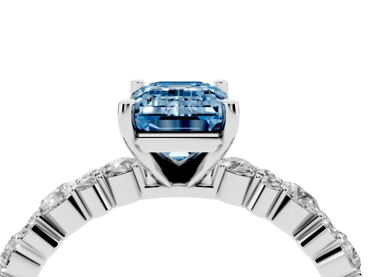 Fancy Blue Emerald Cut Diamond Side Stone Solitaire Ring with Round and Four-Prong Setting White gold