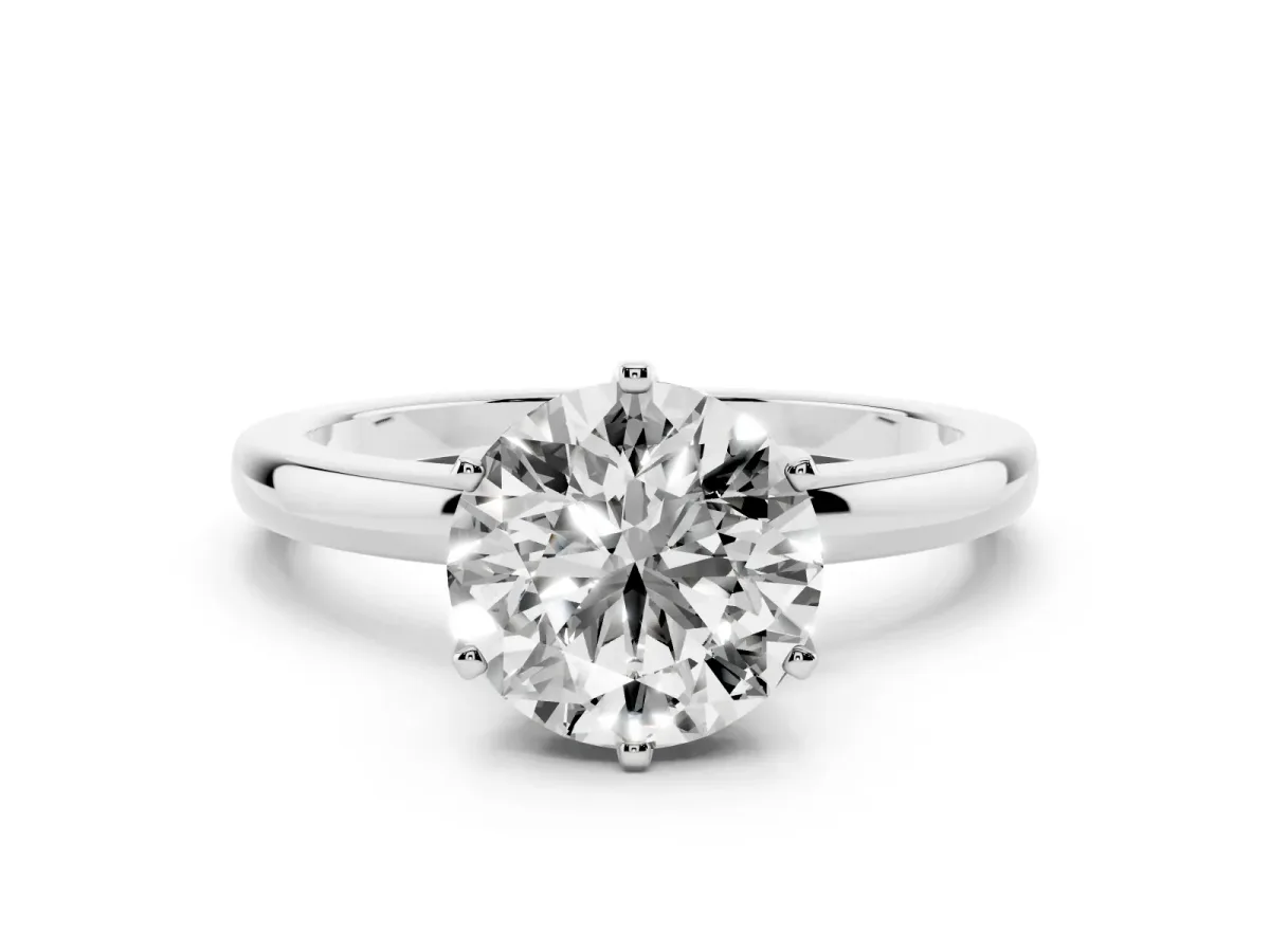 Round Cut Solitaire Diamond Ring with Six-Prong Setting on a Classic Band Silver