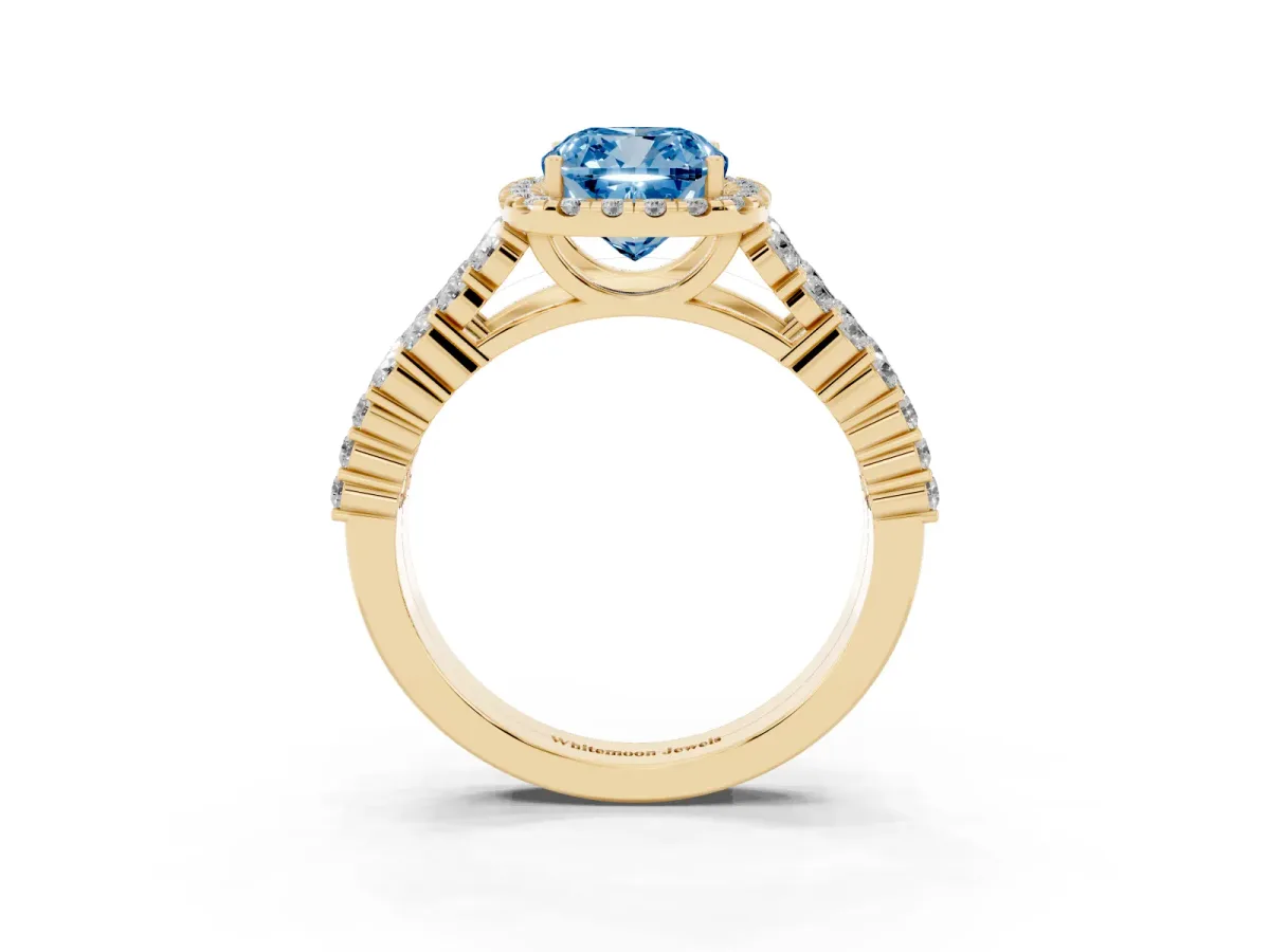 Fancy Blue Cushion Cut Diamond Halo Engagement Ring with Triple Row Round Pavé Band and Prong Setting Yellow gold