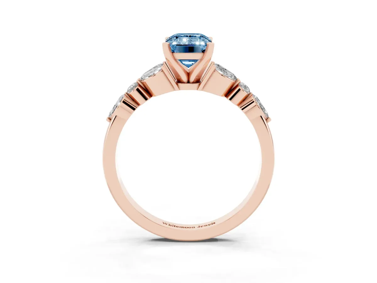 Fancy Blue Emerald Cut Diamond Solitaire Ring with Side Stones and Four-Prong Setting Rose gold