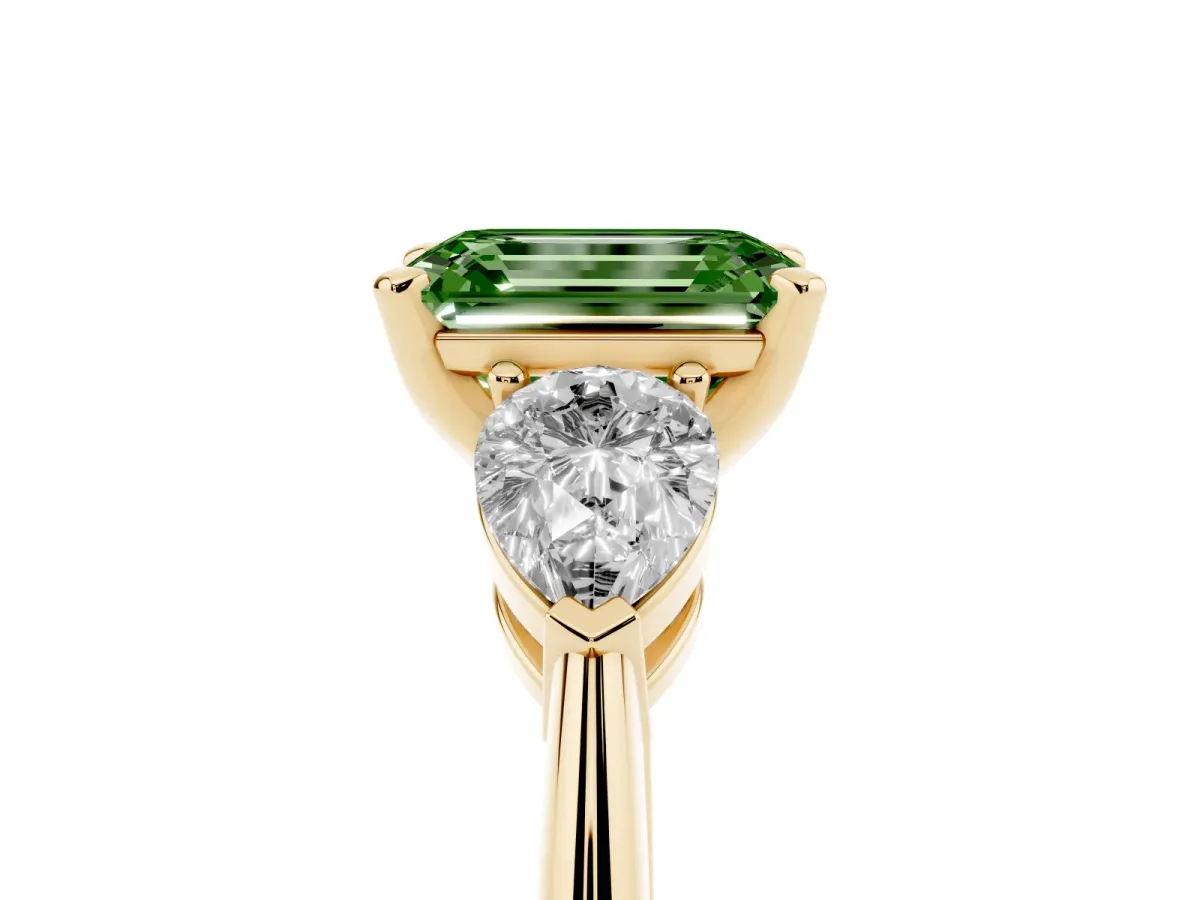 Fancy Green Three-Stone Emerald Cut Diamond Ring with Pear Side Stones and Four-Prong Setting Yellow gold