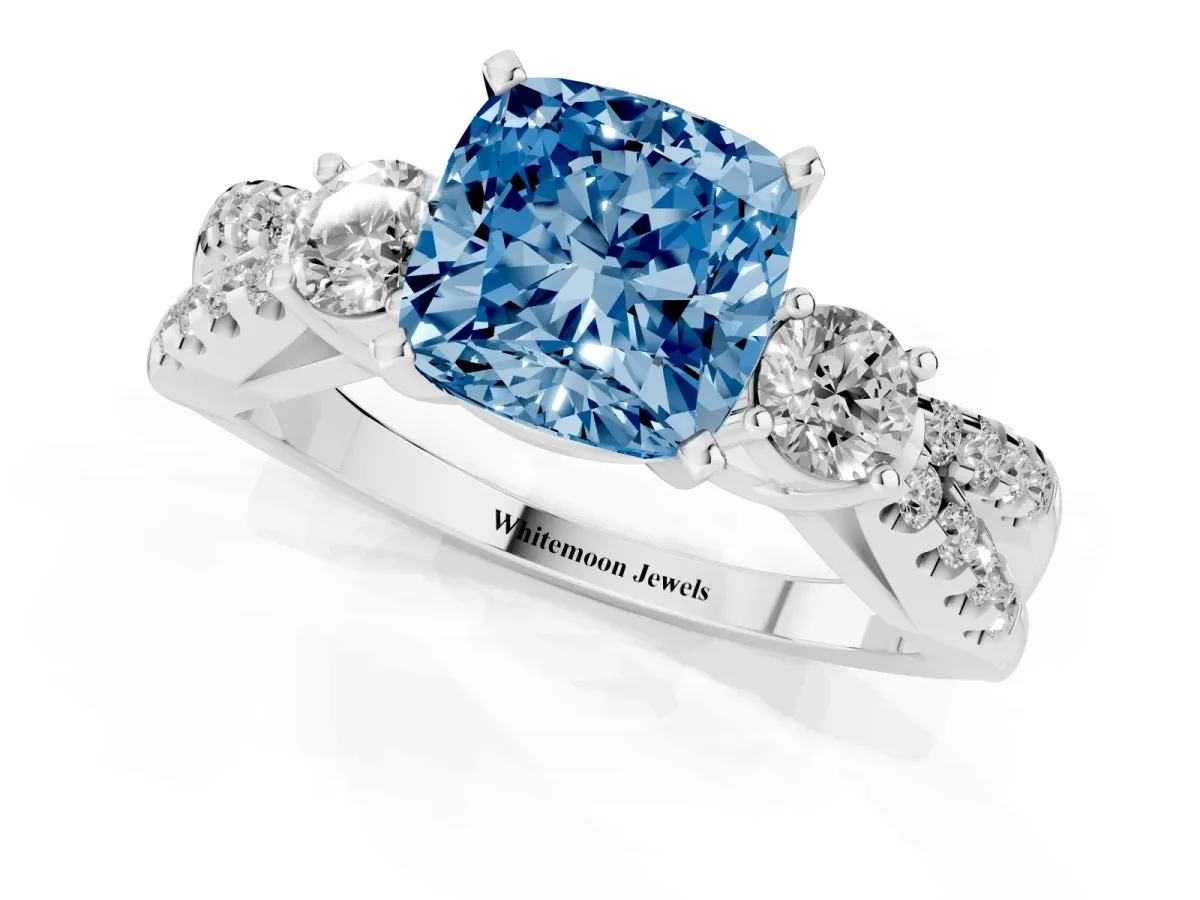 Fancy Blue Cushion Cut Diamond Three-Stone Ring with Pavé Split Shank and Four-Prong Setting Silver