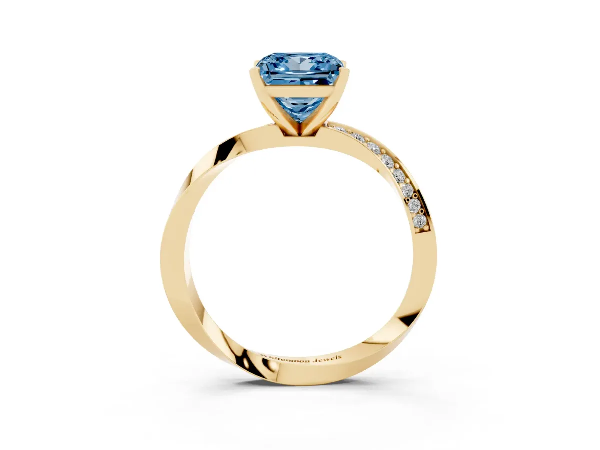 Fancy Blue Princess Cut Diamond Engagement Ring with Side Stone Accents and Four-Prong Setting Yellow gold