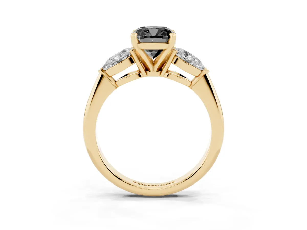 Fancy Black Three-Stone Cushion Cut Diamond Ring with Pear Side Stones and Four-Prong Setting Yellow gold