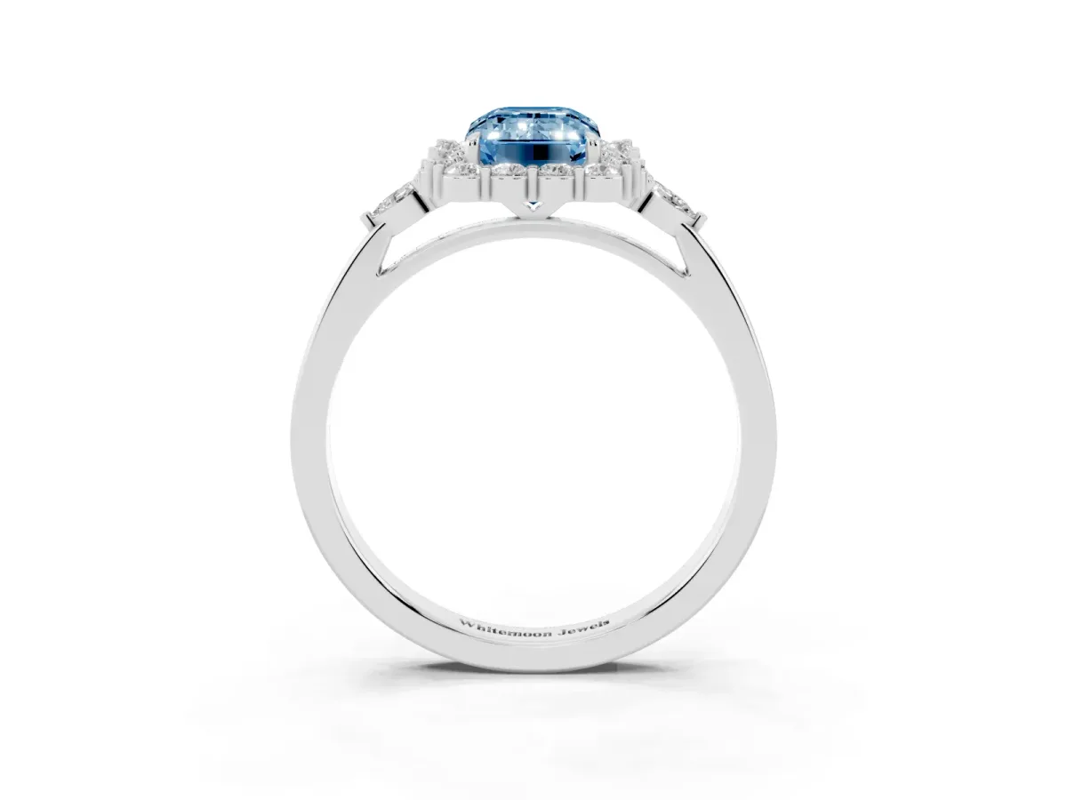 Fancy Blue Emerald Cut Diamond Halo Ring with Pear Side Stones and Prong Setting Platinum