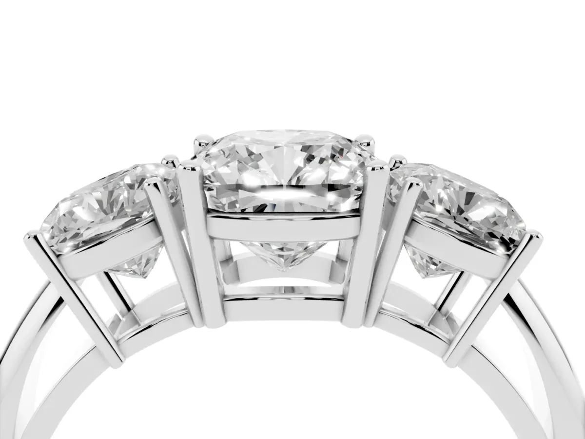 Three-Stone Cushion Cut Cut Diamond Engagement Ring with Prong Setting on a White Gold Band White gold
