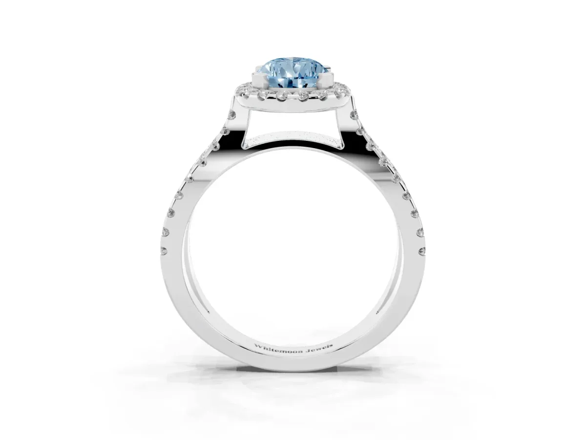 Fancy Blue Pear Cut Diamond Halo Ring with Split Shank Pavé Band and Prong Setting Silver