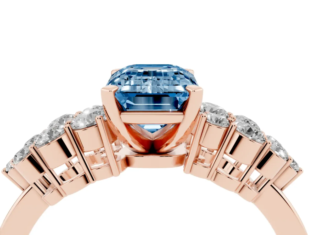 Fancy Blue Emerald Cut Cluster Diamond Engagement Ring with Pavé Band and Four-Prong Setting Rose gold
