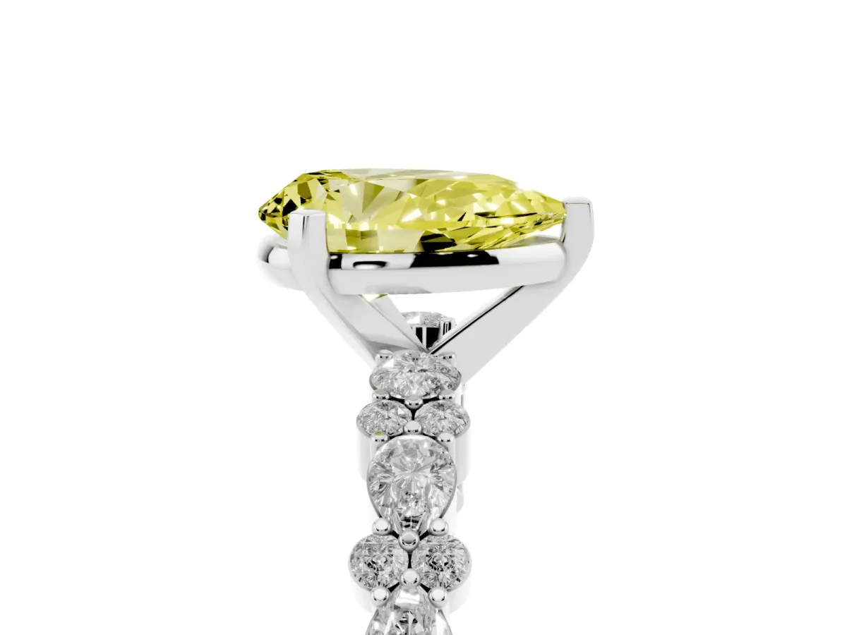Fancy Yellow Pear Cut Diamond Side Stone Solitaire Ring with Round and Four-Prong Setting Platinum
