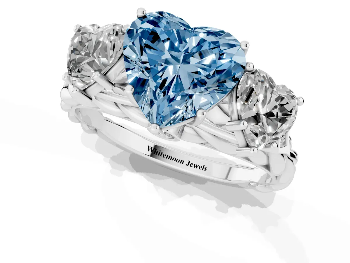 Fancy Blue Three-Stone Heart Cut Diamond Braided Band Ring with Four-Prong Setting Platinum