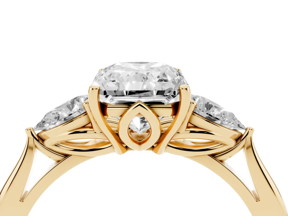 Radiant Cut Diamond Three-Stone Ring with Pear Side Stones and Prong Setting Yellow gold