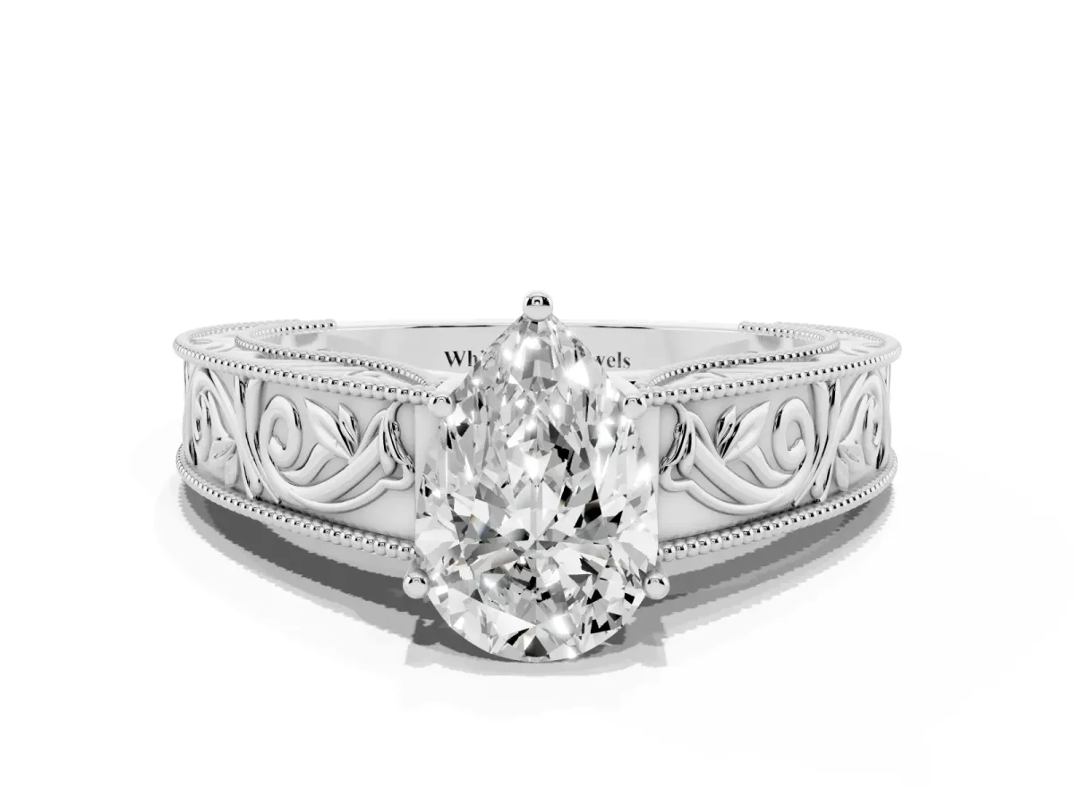Pear Cut Diamond Solitaire Ring with Engraved Band and Four-Prong Setting Silver