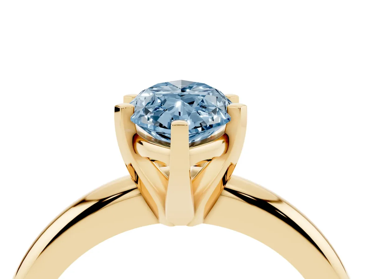 Fancy Blue Marquise Cut Diamond Solitaire Engagement Ring with Round Band and Four-Prong Setting Yellow gold