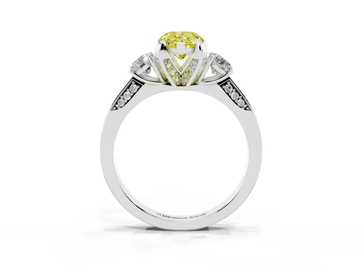 Fancy Yellow Pear Cut Brilliant Three-Stone Diamond Ring with Pavé Band and Four-Prong Setting Platinum
