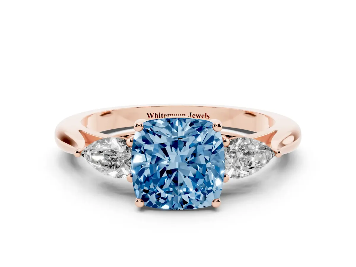 Fancy Blue Three-Stone Cushion Cut Diamond Ring with Pear Side Stones in Four-Prong Setting Rose gold