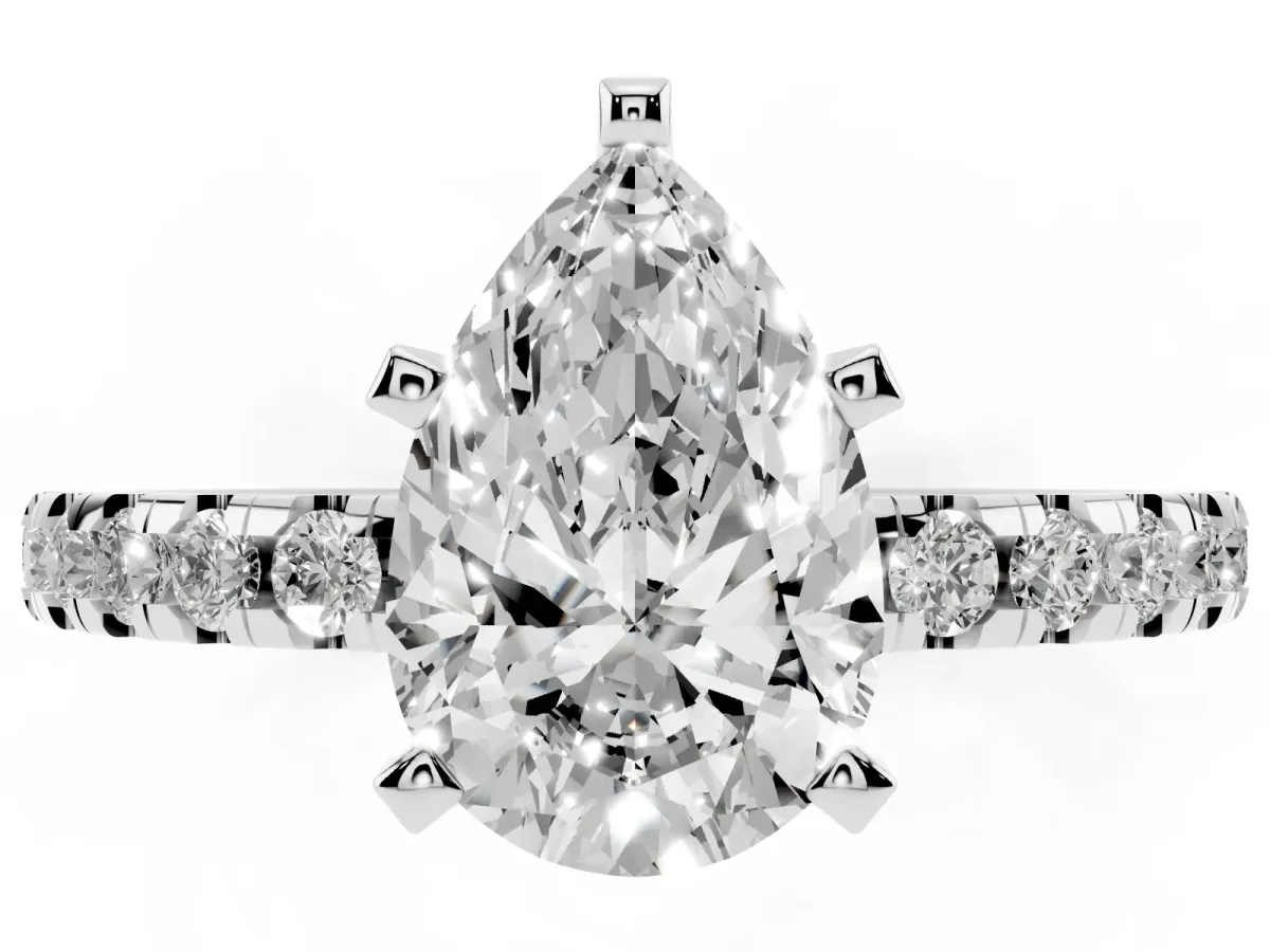 Pear Cut Diamond Solitaire Ring with Round Pavé Band and Four-Prong Setting Silver
